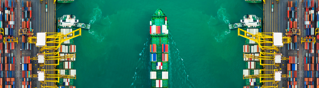 marine cargo ship passing through dock