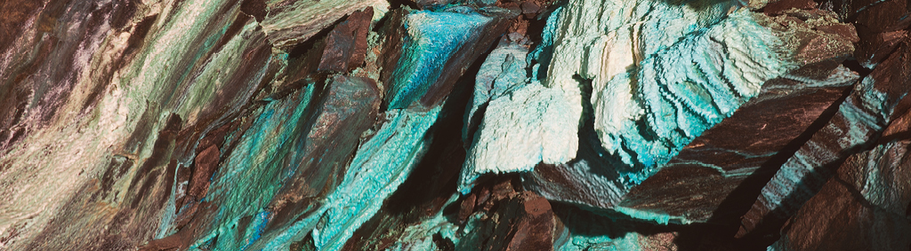 Metals mining gold seam in rock